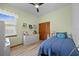 Bedroom with a large window, light green walls, twin bed and roomy closet at 1107 Almond Tree Cir, Orlando, FL 32835