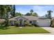 Charming single-story home featuring manicured lawn and inviting covered entryway at 1107 Almond Tree Cir, Orlando, FL 32835