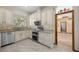Charming kitchen boasts granite countertops and stainless steel appliances at 1107 Almond Tree Cir, Orlando, FL 32835