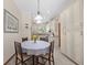 Eat-in kitchen boasts tile floor, updated cabinets, and modern lighting at 1107 Almond Tree Cir, Orlando, FL 32835