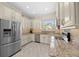 Kitchen features stainless steel appliances, granite counters, and ample cabinet space at 1107 Almond Tree Cir, Orlando, FL 32835