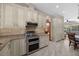 Modern kitchen features stainless steel appliances, granite countertops, and ample storage at 1107 Almond Tree Cir, Orlando, FL 32835