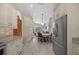 Bright kitchen view shows open floorplan with dining area and living room at 1107 Almond Tree Cir, Orlando, FL 32835