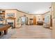 Bright and inviting living room featuring a fireplace, piano, and hardwood floors at 1107 Almond Tree Cir, Orlando, FL 32835