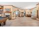 Bright open-concept living room with hardwood floors and fireplace for cozy entertaining at 1107 Almond Tree Cir, Orlando, FL 32835
