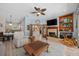Open-concept living area with hardwood floors, fireplace, and French doors at 1107 Almond Tree Cir, Orlando, FL 32835