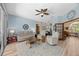 Beautiful living room with nautical decor, light-colored walls, and hardwood floors at 1107 Almond Tree Cir, Orlando, FL 32835