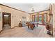 A cozy living room with a pool table and access to a backyard swimming pool at 1107 Almond Tree Cir, Orlando, FL 32835