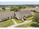 Aerial view of home showcasing lush greenery, nearby pond, and the overall neighborhood at 1146 Villa Ln # 101, Apopka, FL 32712