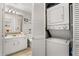 Bright bathroom with vanity and mirror, plus a washer/dryer closet at 1146 Villa Ln # 101, Apopka, FL 32712