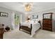 Comfortable bedroom with a full bed, neutral colors, and natural light from the large window at 1146 Villa Ln # 101, Apopka, FL 32712