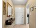 Hallway leading to the entrance, featuring decor and access to the kitchen at 1146 Villa Ln # 101, Apopka, FL 32712