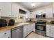 Bright kitchen equipped with stainless steel appliances and ample counter space at 1146 Villa Ln # 101, Apopka, FL 32712