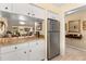 Kitchen showcases stainless steel refrigerator, with views into the hallway and living areas at 1146 Villa Ln # 101, Apopka, FL 32712