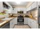 Well-lit kitchen featuring stainless steel appliances and granite countertops at 1146 Villa Ln # 101, Apopka, FL 32712