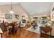 Spacious living room with hardwood floors, vaulted ceilings, and views of the outdoor patio at 1146 Villa Ln # 101, Apopka, FL 32712