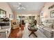 Cozy living room features hardwood floors, comfortable seating, and natural light from the sliding glass doors at 1146 Villa Ln # 101, Apopka, FL 32712