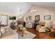 Open-concept living room featuring vaulted ceilings, hardwood floors, and comfortable seating areas at 1146 Villa Ln # 101, Apopka, FL 32712