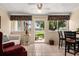 Relaxing sun room with tile flooring, views of the backyard, and access to an outdoor patio at 1146 Villa Ln # 101, Apopka, FL 32712