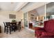 Open sun room with tile flooring, seamlessly connected to the living area through sliding glass doors at 1146 Villa Ln # 101, Apopka, FL 32712