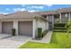 Charming townhome with a well-manicured lawn, attached garages and beautiful curb appeal at 148 Olive Tree Cir # 148, Altamonte Springs, FL 32714