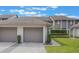 Inviting townhouse featuring attached garages, well-kept landscaping, and a serene neighborhood setting at 148 Olive Tree Cir # 148, Altamonte Springs, FL 32714