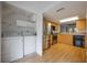 Efficient kitchen with modern stainless appliances, washer, dryer, and bright overhead lighting at 148 Olive Tree Cir # 148, Altamonte Springs, FL 32714