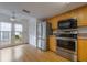 Functional kitchen with stainless steel appliances, wood cabinets, and eat-in dining area at 148 Olive Tree Cir # 148, Altamonte Springs, FL 32714