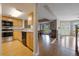 Charming kitchen with wooden cabinets and appliances, adjacent to dining and living spaces at 148 Olive Tree Cir # 148, Altamonte Springs, FL 32714
