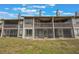 Back of the condo with balconies and sliding screen doors at 148 Olive Tree Cir # 148, Altamonte Springs, FL 32714