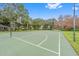 A large basketball court with lights, green space and a pavilion in the background at 1515 Cherry Lake Way, Lake Mary, FL 32746
