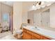 Bright bathroom with a large mirror and a door to the outside at 1515 Cherry Lake Way, Lake Mary, FL 32746