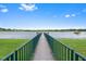 Long dock over lake offers an ideal spot for enjoying scenic water views at 1515 Cherry Lake Way, Lake Mary, FL 32746