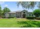 Charming single-story home with lush front lawn and attractive landscaping under a cloudy sky at 1515 Cherry Lake Way, Lake Mary, FL 32746