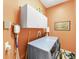 Laundry room features include cabinets and a modern washer and dryer set at 1515 Cherry Lake Way, Lake Mary, FL 32746