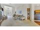 Bright living room with high ceilings, arched doorways, and neutral carpet at 1515 Cherry Lake Way, Lake Mary, FL 32746
