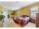 Spacious main bedroom with neutral carpet, decorative paint, and large windows providing natural light, plus sitting area at 1515 Cherry Lake Way, Lake Mary, FL 32746