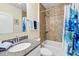 Bathroom with a tub, shower, and vanity at 15411 Taurus Ct, Mascotte, FL 34753
