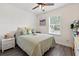 Cozy bedroom with a window and modern décor at 15411 Taurus Ct, Mascotte, FL 34753