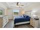 Bright bedroom with a ceiling fan and a window to the outdoors at 15411 Taurus Ct, Mascotte, FL 34753