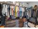 Organized walk-in closet with built-in storage and hanging racks at 15411 Taurus Ct, Mascotte, FL 34753