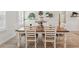Close up view of dining room table with seating for six at 15411 Taurus Ct, Mascotte, FL 34753