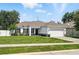 Well-maintained home with a lush green lawn and inviting curb appeal at 15411 Taurus Ct, Mascotte, FL 34753