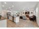 Spacious kitchen featuring island with sink and seating, as well as stainless appliances at 15411 Taurus Ct, Mascotte, FL 34753