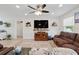 Comfortable living room with lots of seating and a large flat screen TV at 15411 Taurus Ct, Mascotte, FL 34753