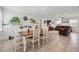 Spacious dining and living area with a seamless flow, perfect for entertaining at 15411 Taurus Ct, Mascotte, FL 34753