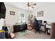 Home office with natural light, a ceiling fan, and 2 workstations at 15411 Taurus Ct, Mascotte, FL 34753