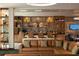 Hotel bar featuring a full selection of liquor, comfortable seating, and a modern design at 15695 Grove Resort Ave # 4412, Winter Garden, FL 34787