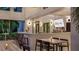 Stylish outdoor bar area with contemporary design, comfortable seating, and a relaxed ambiance for social gatherings at 15695 Grove Resort Ave # 4412, Winter Garden, FL 34787