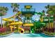 Colorful water slides tower near a blue pool, surrounded by tropical landscaping on a sunny day at the resort at 15695 Grove Resort Ave # 4412, Winter Garden, FL 34787